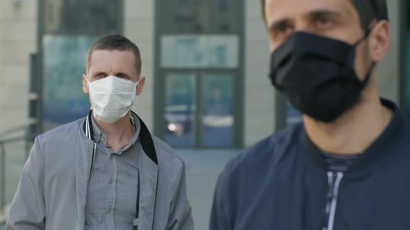 Two Men Is Protective Masks on the Street