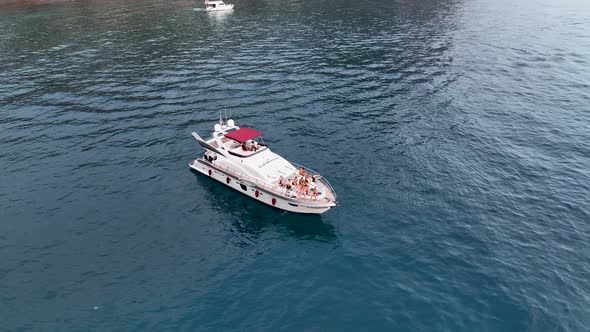 A large yacht stands at sea aerial view 4 K