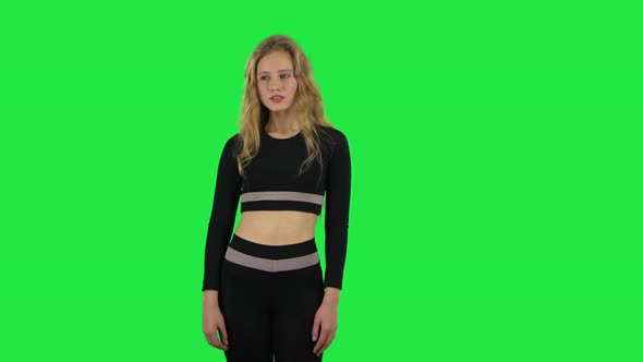 Blonde Girl Looking with Excitement, Then Smiling When Received Pleasant Information. Green Screen