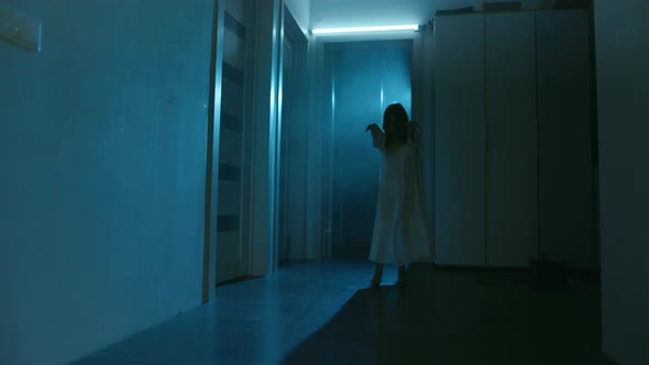 Ghost Girl In White Nightgown With Loose Hair In A Scary House