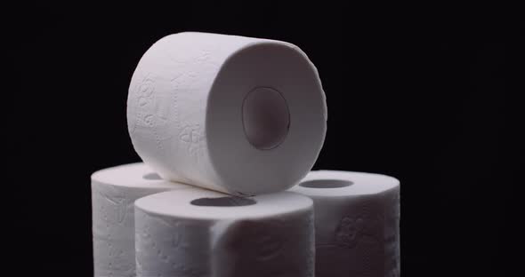 Toilet Paper Isolated on Black Background Rotating