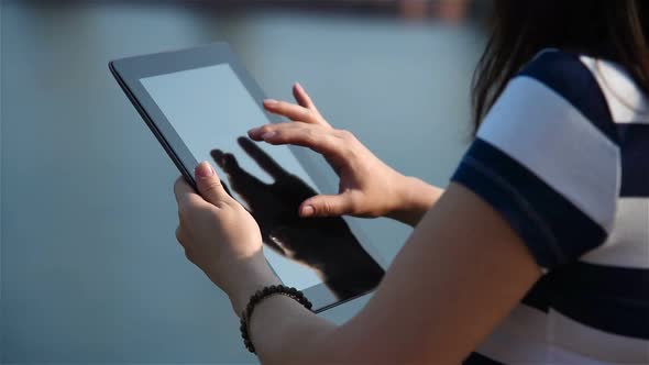 Girl Touching Tablet Computer