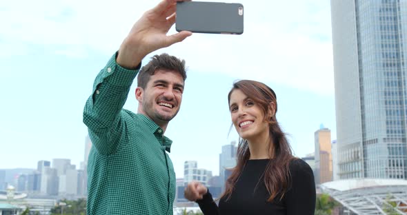 Tourist visit Hong Kong and taking selfie on mobile phone