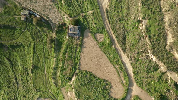 AERIAL: Top Down Shot of Farmland near Malta Coastline