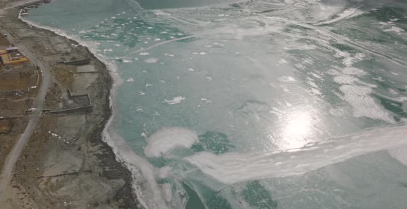 Top aerial shot of attabad lake hunza covered in ice during winter season in Pakistan.