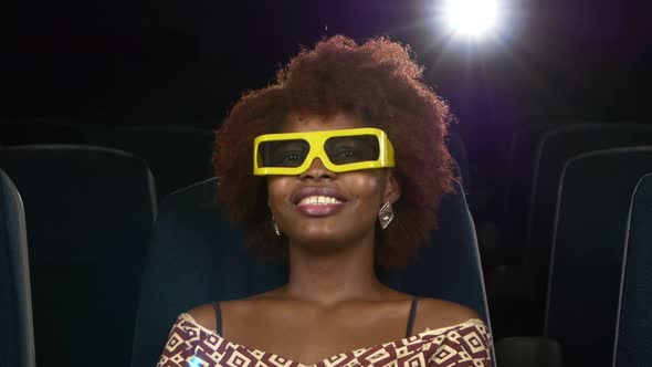 Portrait of Smiling African American Watching Woman Movie in Theater. 3D Glasses