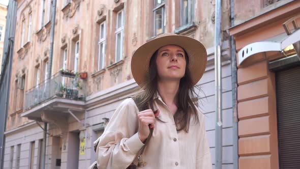 Young Tourist Walking Through the Ancient City in Summer