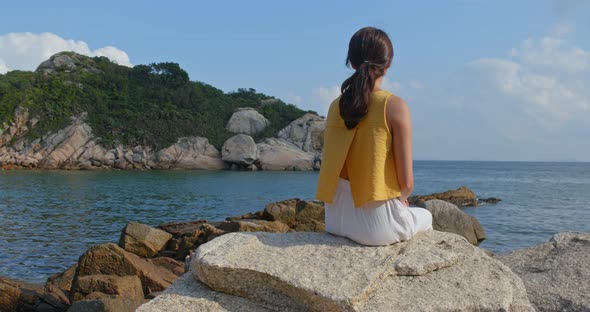 Woman enjoy the view of the sea