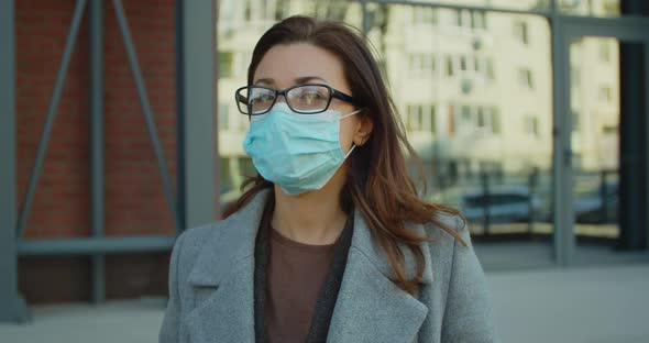 Attractive Serious Businesswoman at Street Near Business Center in Quarantine