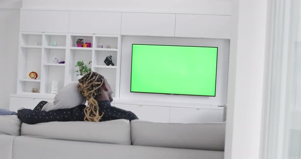Green Screen Tv with African Couple on Sofa