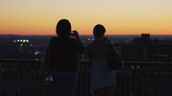 Women Admiring the View and Taking Pictures