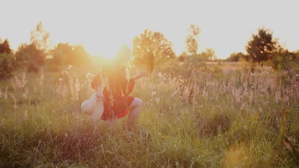 Portrait of Positive Smiling Woman Looking Into Camera at Sunset