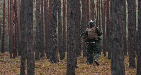 Squad of Soldiers During Military Operation Fully Equipped Camouflage on a Reconnaissance Military