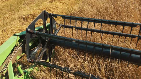 Close Up of Modern Combine Harvest Thrasher at Work. Overhead