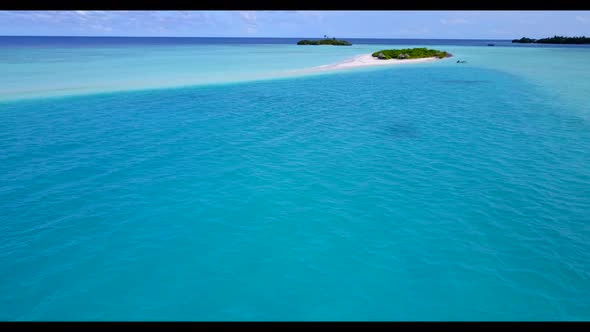 Aerial drone shot travel of tranquil coast beach holiday by blue ocean and white sandy background of