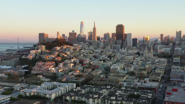 Forward Aerial Pan of San Francisco Skyline and Golden Gate Bridge at Sunset
