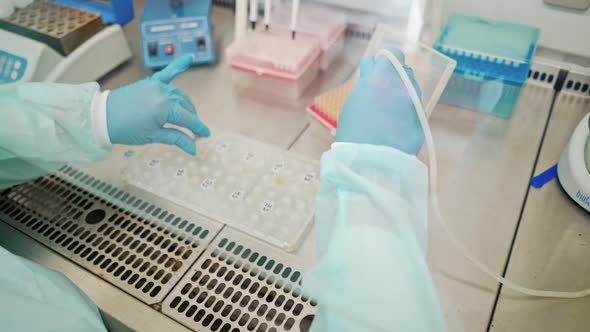 Laboratory assistant working with test tubes