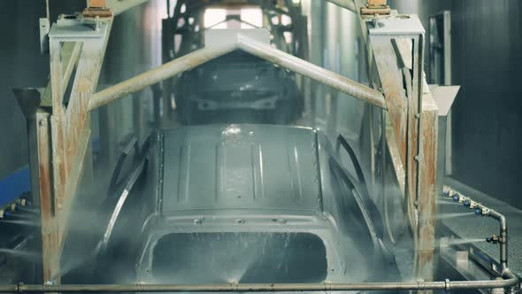 Automobile Carcass Is Getting Lifted Out of Liquid Zinc