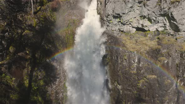 Waterfall Rushing Down a Rocky Canyon in the Canadian Mountains