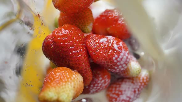 Slow Motion Milk Pouring on Strawberries in Blender, Healthy Smoothie Breakfast Closeup
