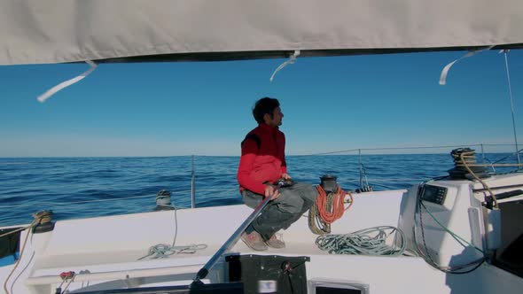 Professional Yachtsman on Sail Boat in Sea