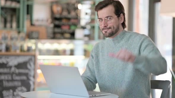 Thumbs Down By Young Man Laptop