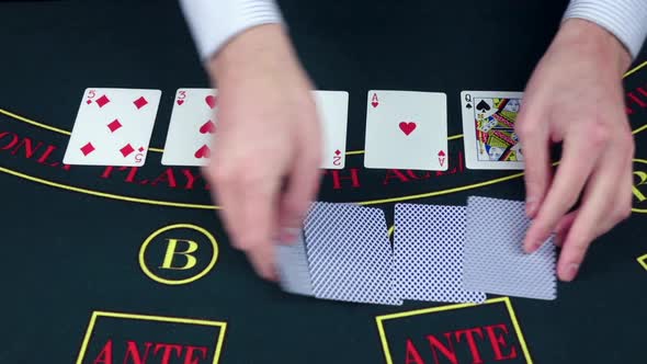 Croupie Takes the Poker Cards on Green Table, Slow Motion