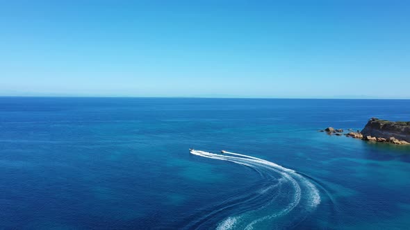 Aerial View of a Motor Boat Towing a Tube. Zakynthos, Greece