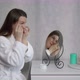 Young Woman Takes Care of Skin of Face - VideoHive Item for Sale
