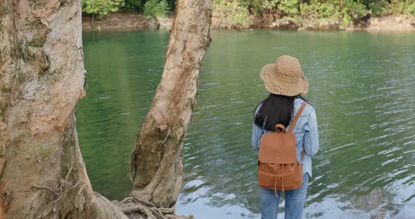 Woman taking photo on cellphone when hiking