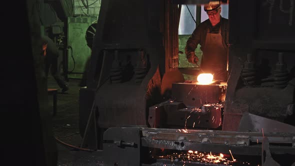 Forger Man Working With Hot Steel At Forgery Shop