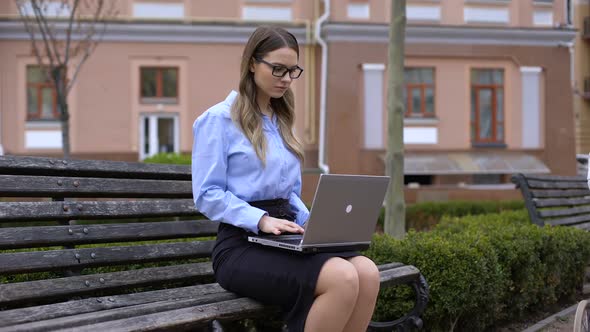 Woman Working Laptop Looking Mother With Carriage Passing By, Dreaming of Baby