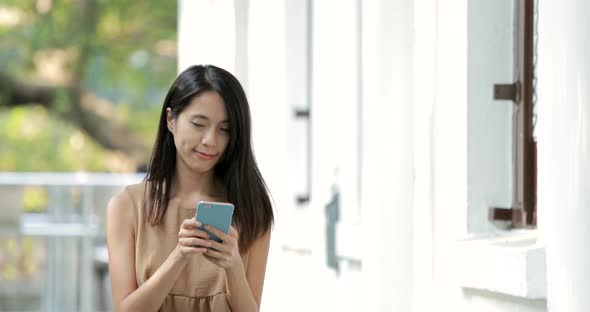 Woman using smart phone at outdoor 