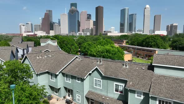 Downtown Houston. Residential homes to aerial reveal of skyline.