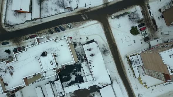 Aerial view of multistorey high apartment buildings and streets witn traffic in a city