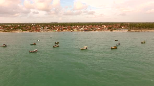 Aerial view of traditional fishing boats moored in Rio do Fogo, Brazil.