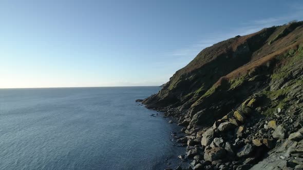 Coastal erosion of the cliffs along the coastline, aerial fly over