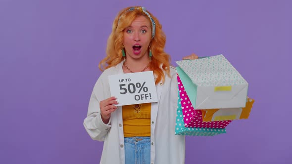 Cheerful Redhead Girl Showing Shopping Bags Up To 50 Percent Off Inscriptions Banner Black Friday