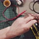 Male hands repairing wire - VideoHive Item for Sale