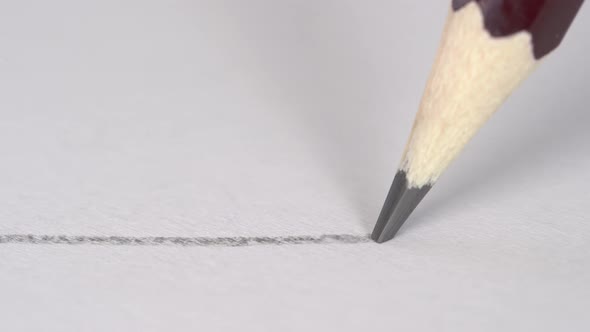 Artist hand drawing a flat gray line with graphite wooden pencil on white paper