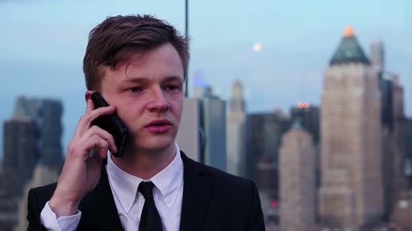 Young Businessman Talking on Mobil Phone