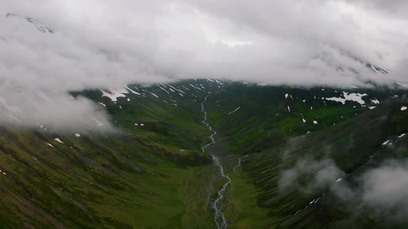 Aerial View of Nordic Landscape Flyover Green Valley Beautiful Formations and Mountains Covered with