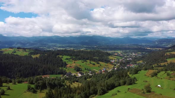 Flight Over a Mountain Cottage Village in Poland, Zakopany, Tatra National Park Aerial 4K Video