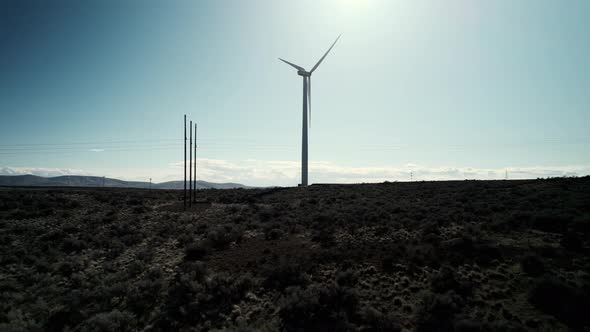 Looking up slowly panning, a large wind turbine, green energy, renewable, aerial