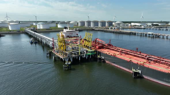 Crude Oil Liquid Cargo Transporter Ship Unloading Petrochemicals to a Fuel Depot