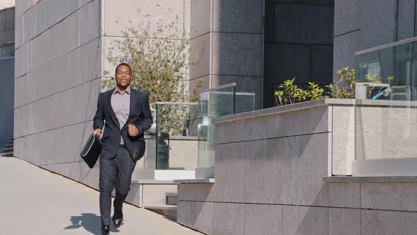 Happy African American Businessman Winner Leaving Office Building Excited By Good News Got New Job