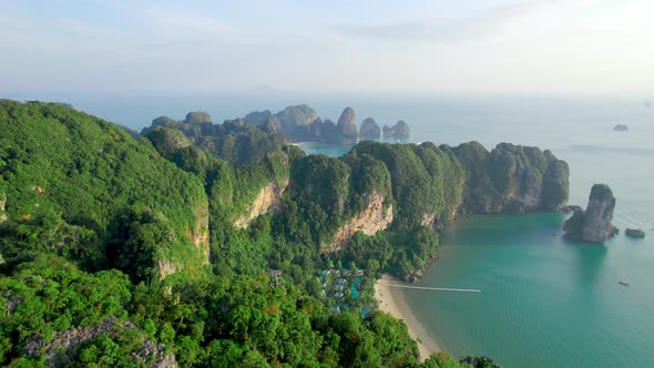 Opening View on Coastline of Tropical Island with Cliffs and Rocks Aerial Shot