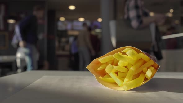 Fast Food French Fries Potatoes Lie on Table Inside Cafe Restaurant