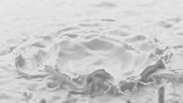 Super Slow Motion Detail Shot of Splashing Fresh Milk at 1000 Fps alt