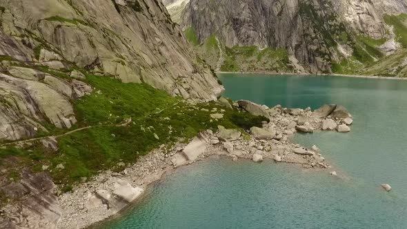 mountain lake in the swiss alps, reservoir in the middle of the mountains